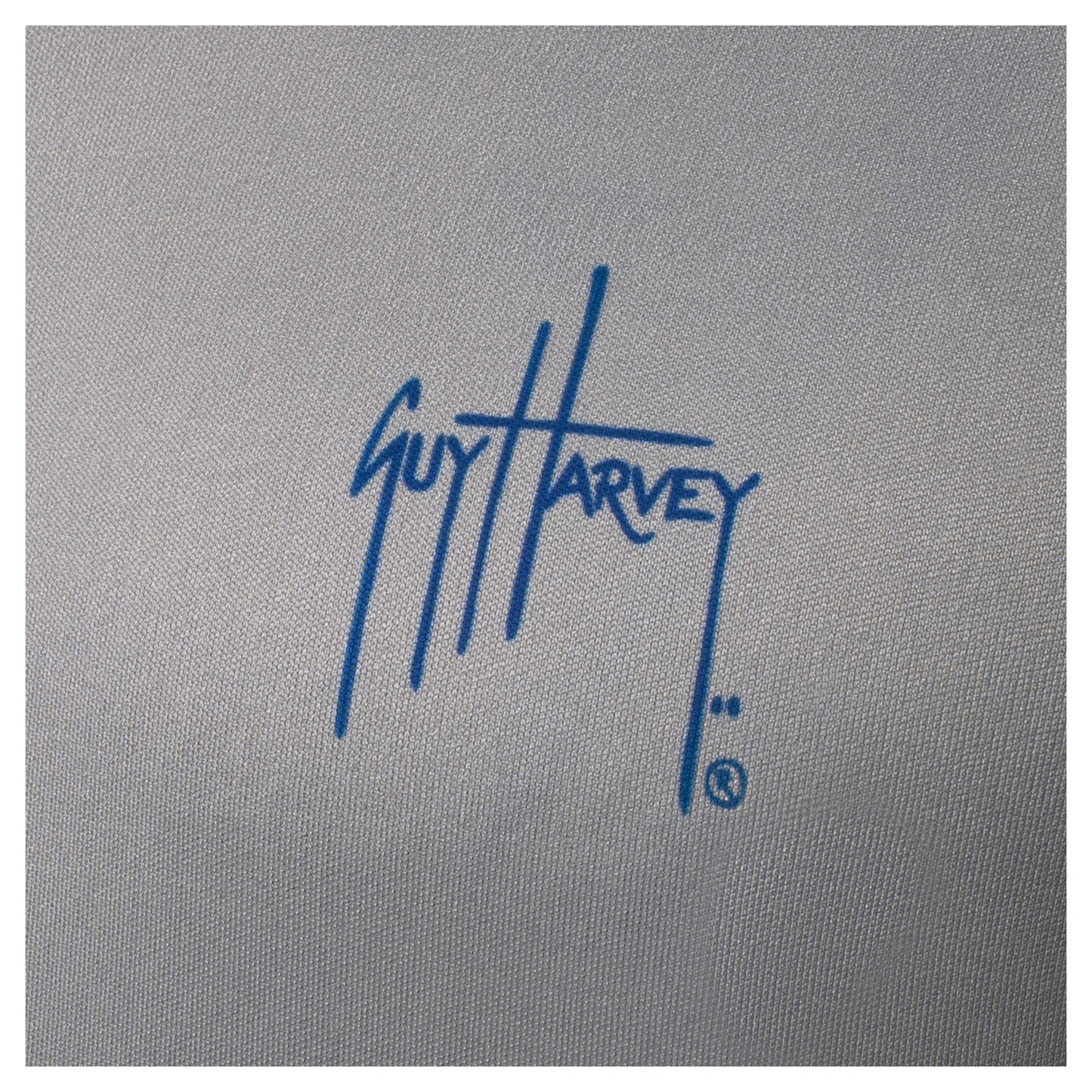 Close-up of blue Guy Harvey logo printed on left chest of light gray Men’s Bass Diamond Hoodie.