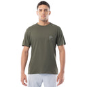 Man wearing a green t-shirt with a logo on a white background