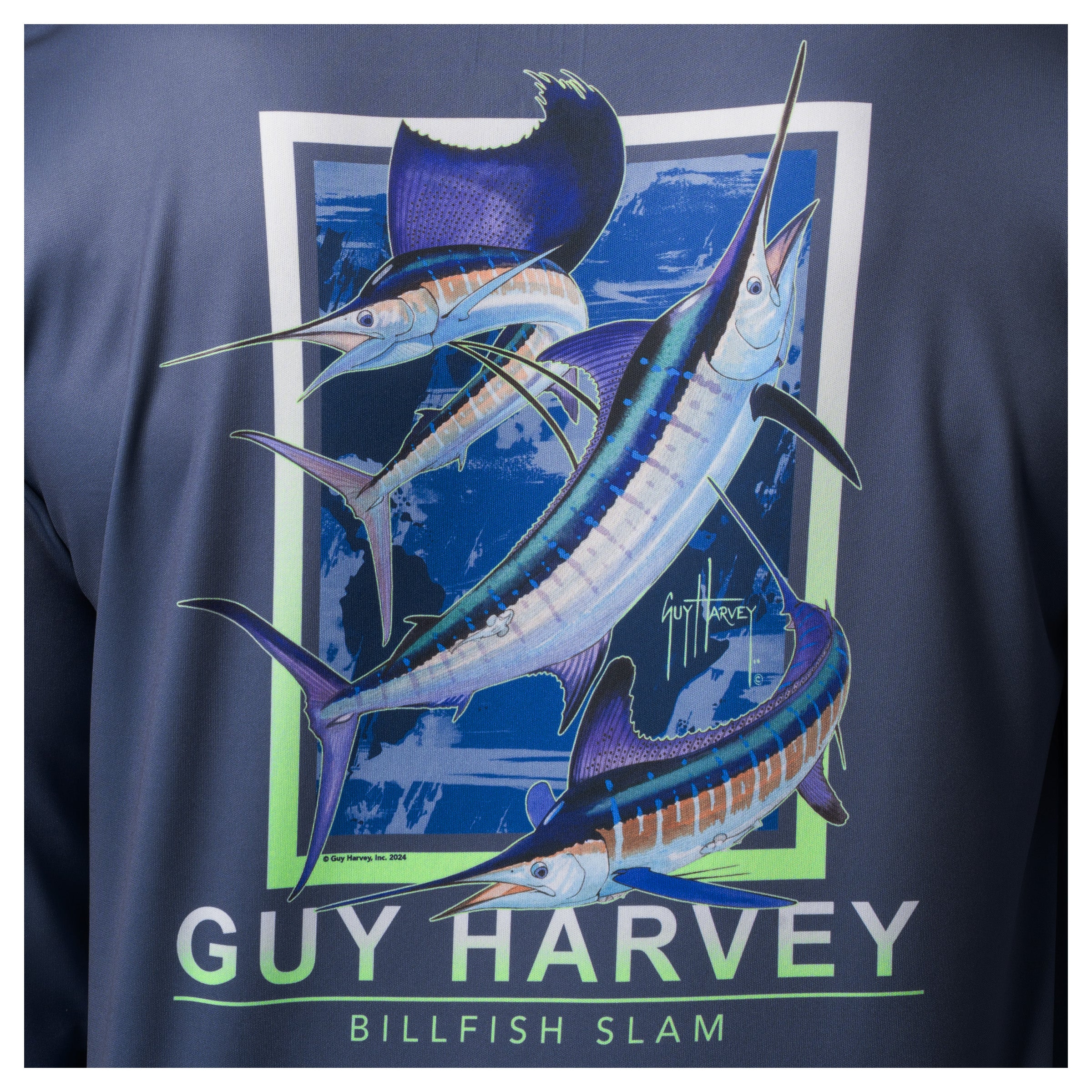 Close-up of Guy Harvey “Billfish Slam” artwork with detailed billfish illustration on navy blue fabric.