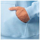 Close-up of a hand in the front pocket of a light blue Guy Harvey fishing fleece hoodie.