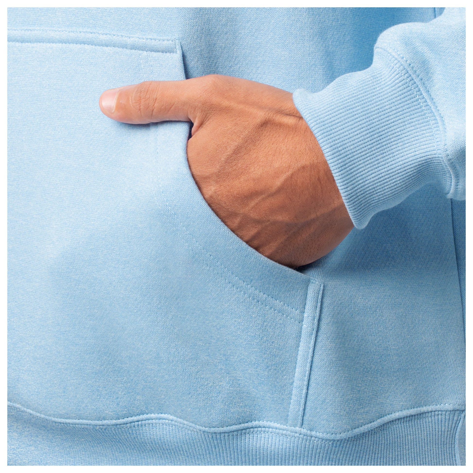 Close-up of a hand in the front pocket of a light blue Guy Harvey fishing fleece hoodie.