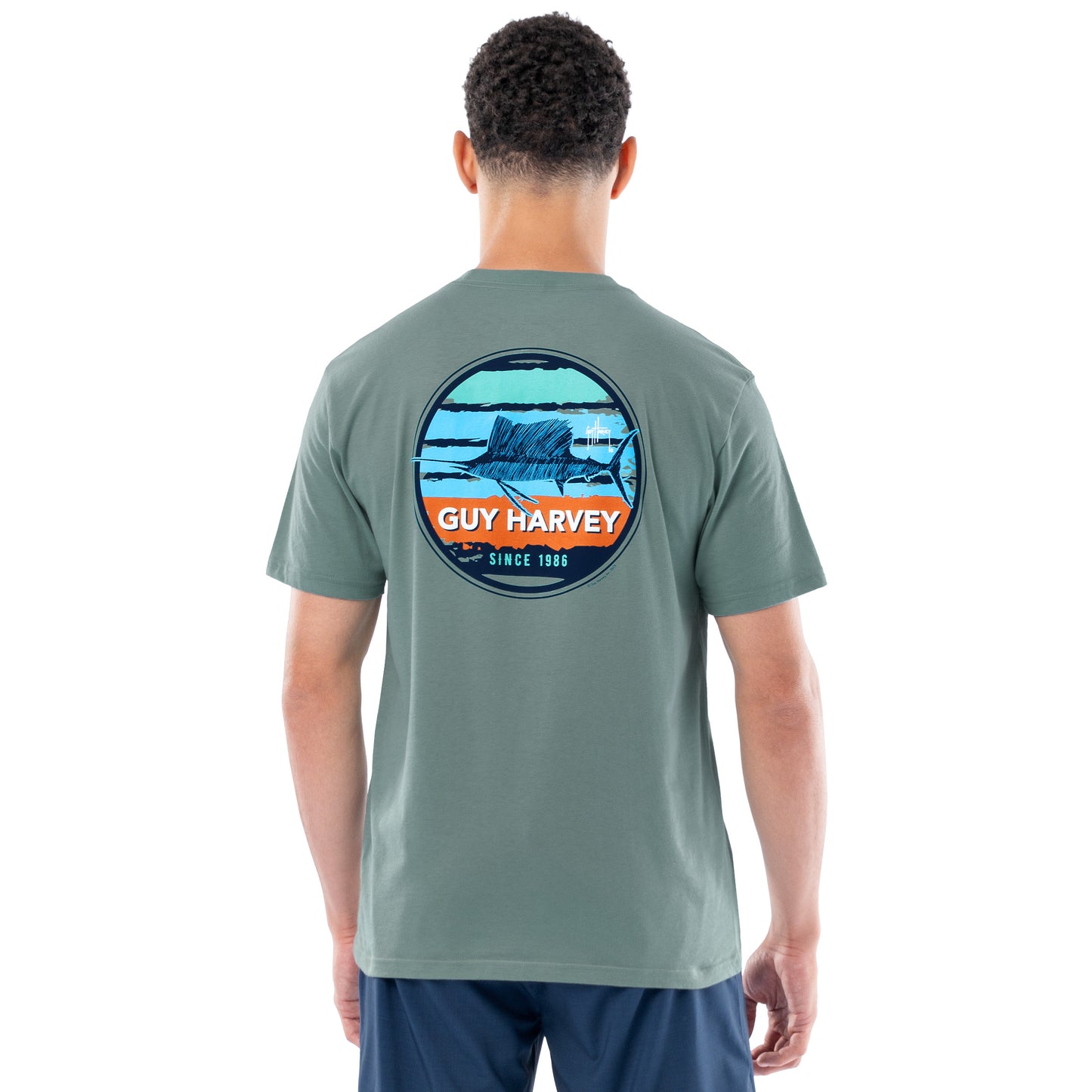 Person wearing a Guy Harvey t-shirt with a sailfish graphic on the back