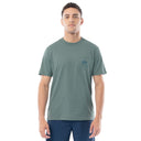Man wearing a green t-shirt with a small logo on a white background