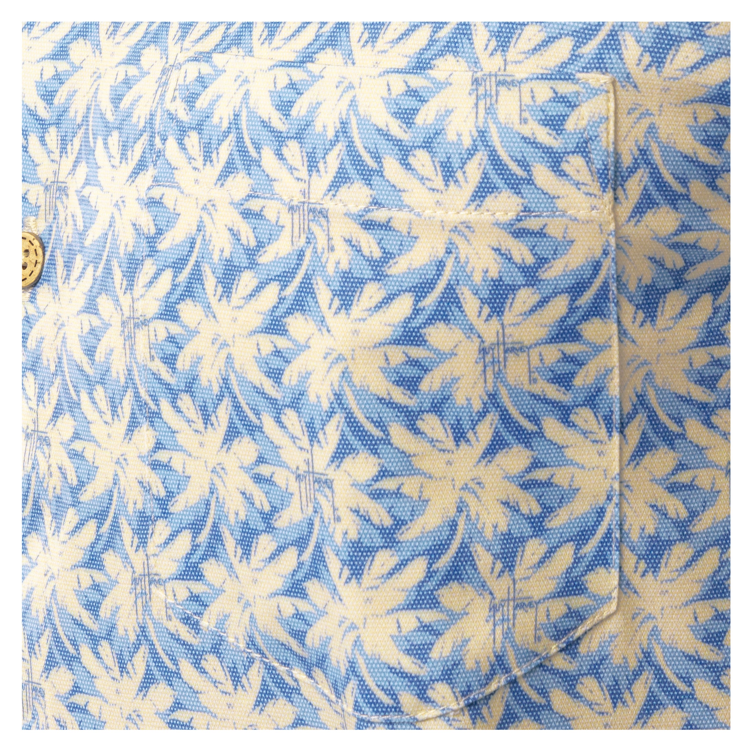 Close-up of left chest pocket on blue and sand Guy Harvey Dot Palm Printed Resort Shirt.