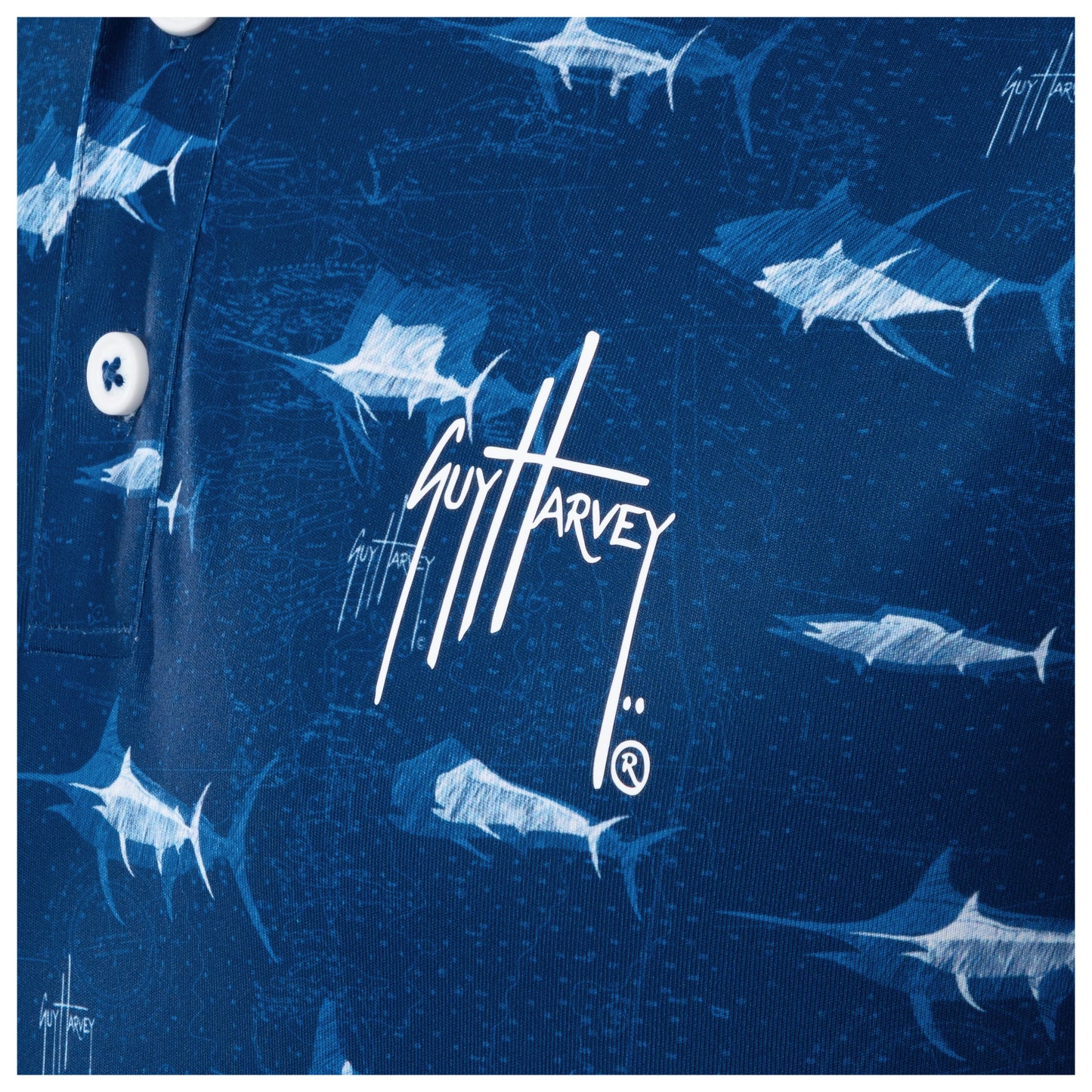 Detail of white Guy Harvey signature logo and marlin print on ocean blue fabric.