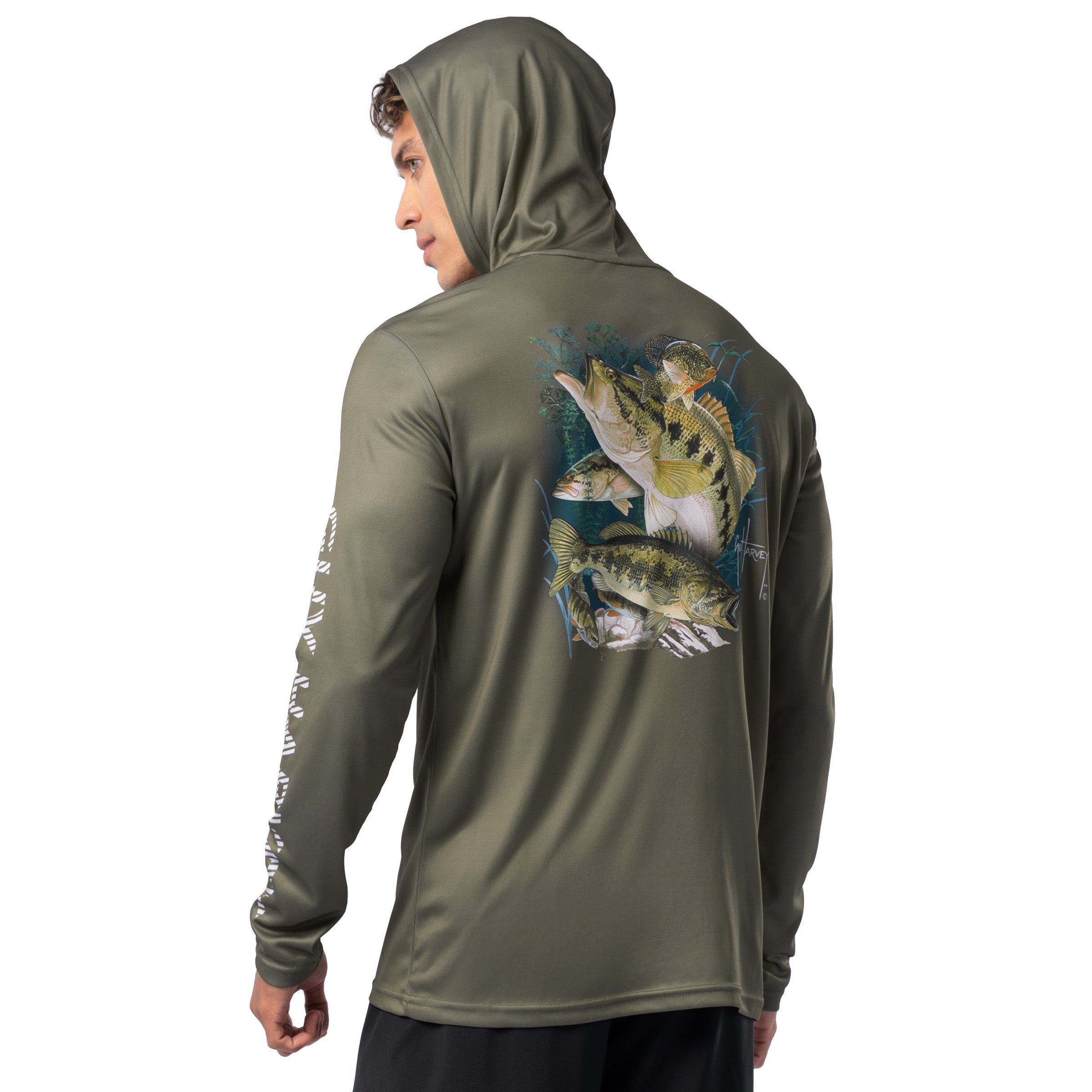 Model wearing olive green Guy Harvey Men’s Freshwater Fantasy Sun Protection Hoodie showing detailed freshwater fish artwork on back.