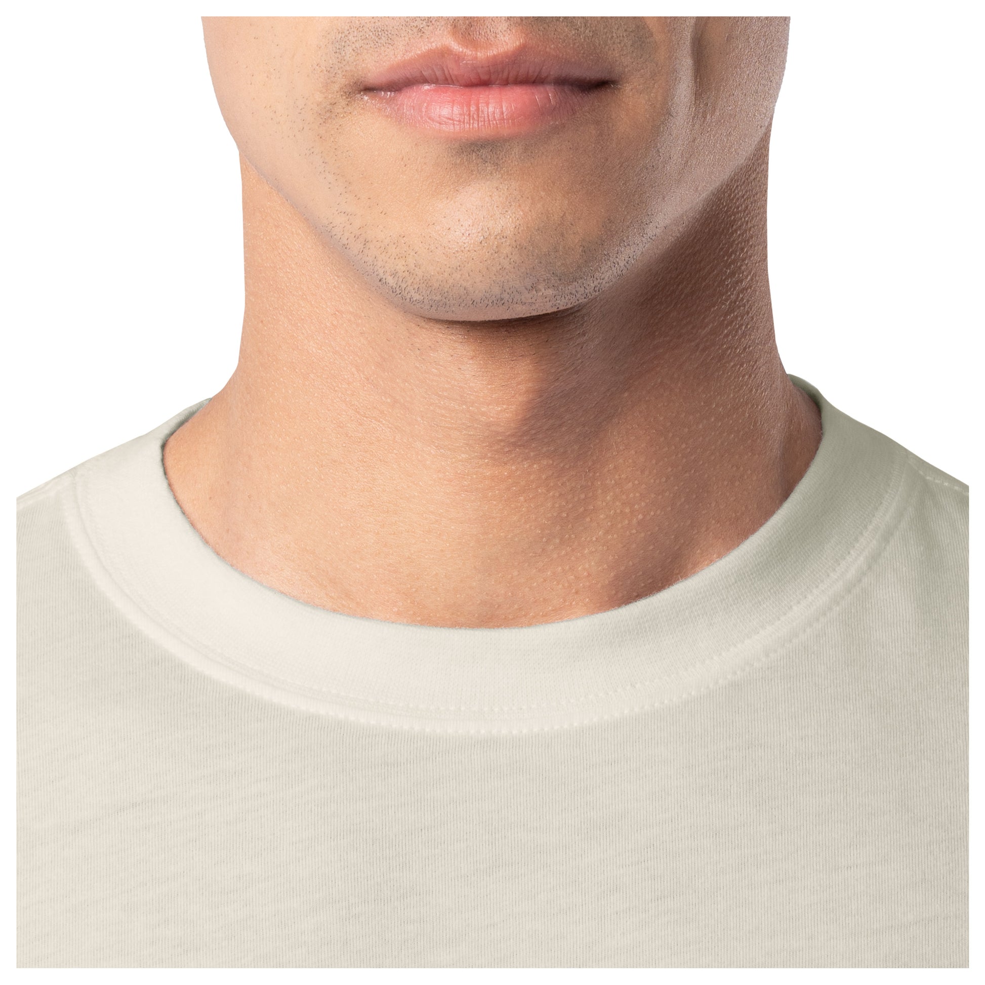 Close-up of a person wearing a beige shirt with a plain background