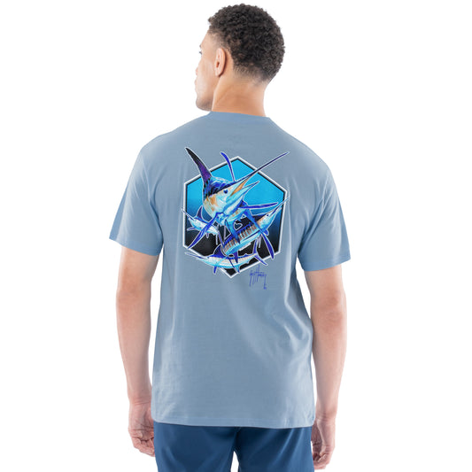 Man wearing a light blue t-shirt with a graphic design of a pack of marlins on the back, standing against a white background