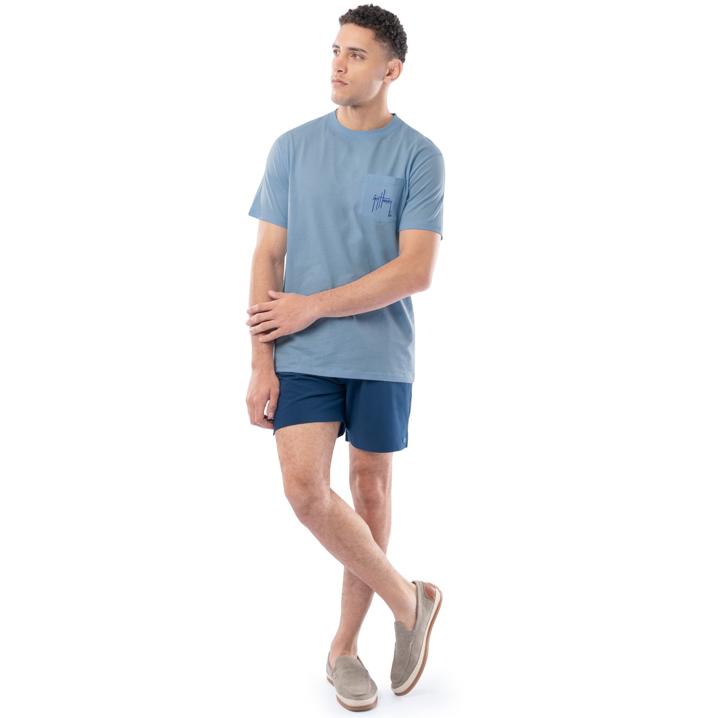 Man wearing a blue t-shirt and shorts on a white background