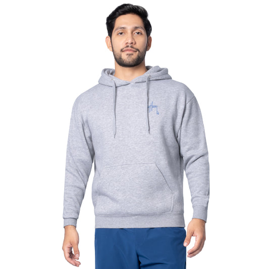 Front view of a man wearing a light gray Guy Harvey fishing fleece hoodie with blue Guy Harvey logo on the chest.