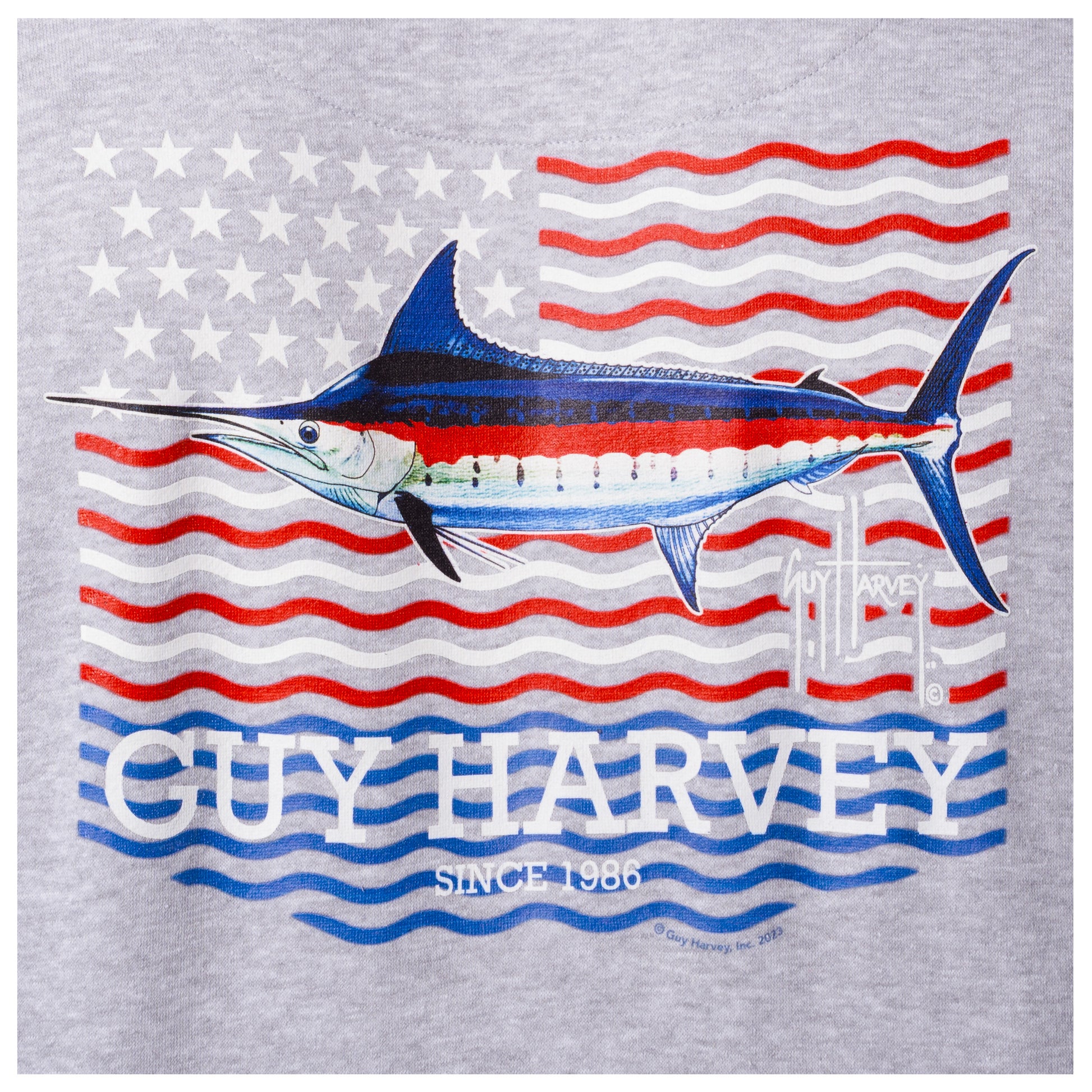 Close-up of the marlin and American flag design printed on the back of a light gray Guy Harvey fishing fleece hoodie.