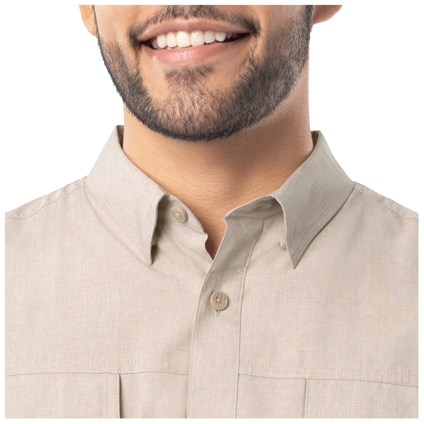 Close-up of a beige shirt worn by a person on a white background