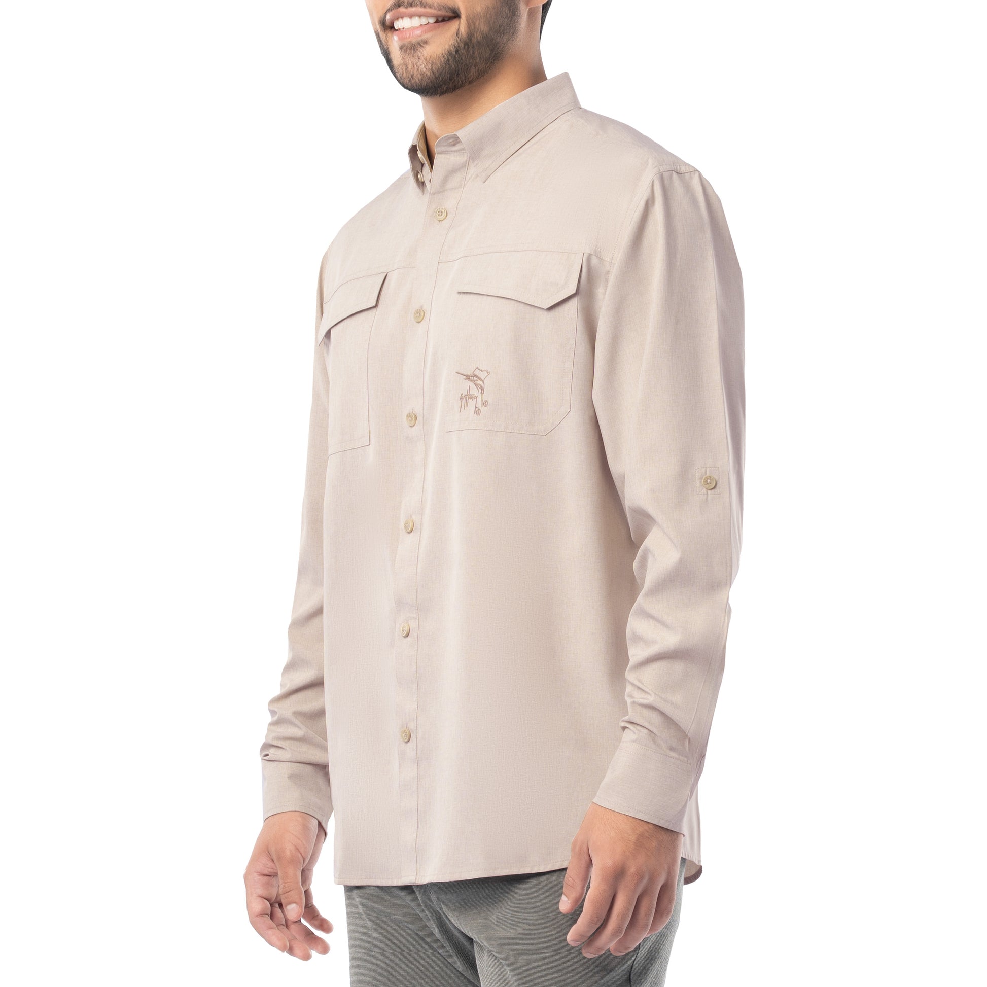 Man wearing a beige long-sleeve shirt on a white background