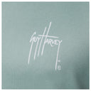 White Guy Harvey signature logo printed on left chest of seafoam green Men’s Mahi Gear Hoodie.