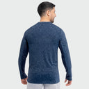 A male wearing a Guy Harvey Mens Marlin Air Sun Protection Top in a topographical print in navy blue