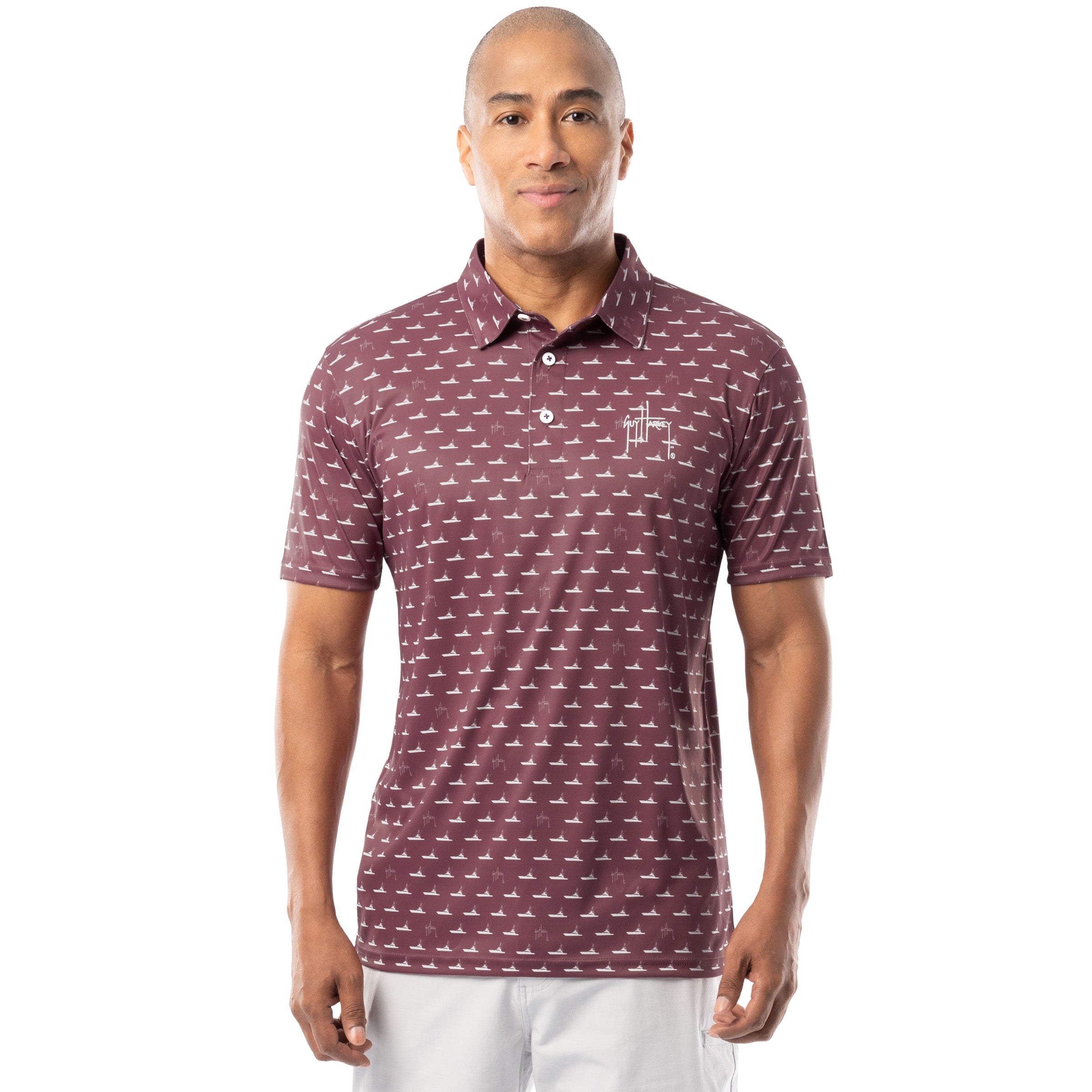 Front view of red wine Guy Harvey Men’s Red Fleet Printed Performance Polo Shirt with white boat pattern.