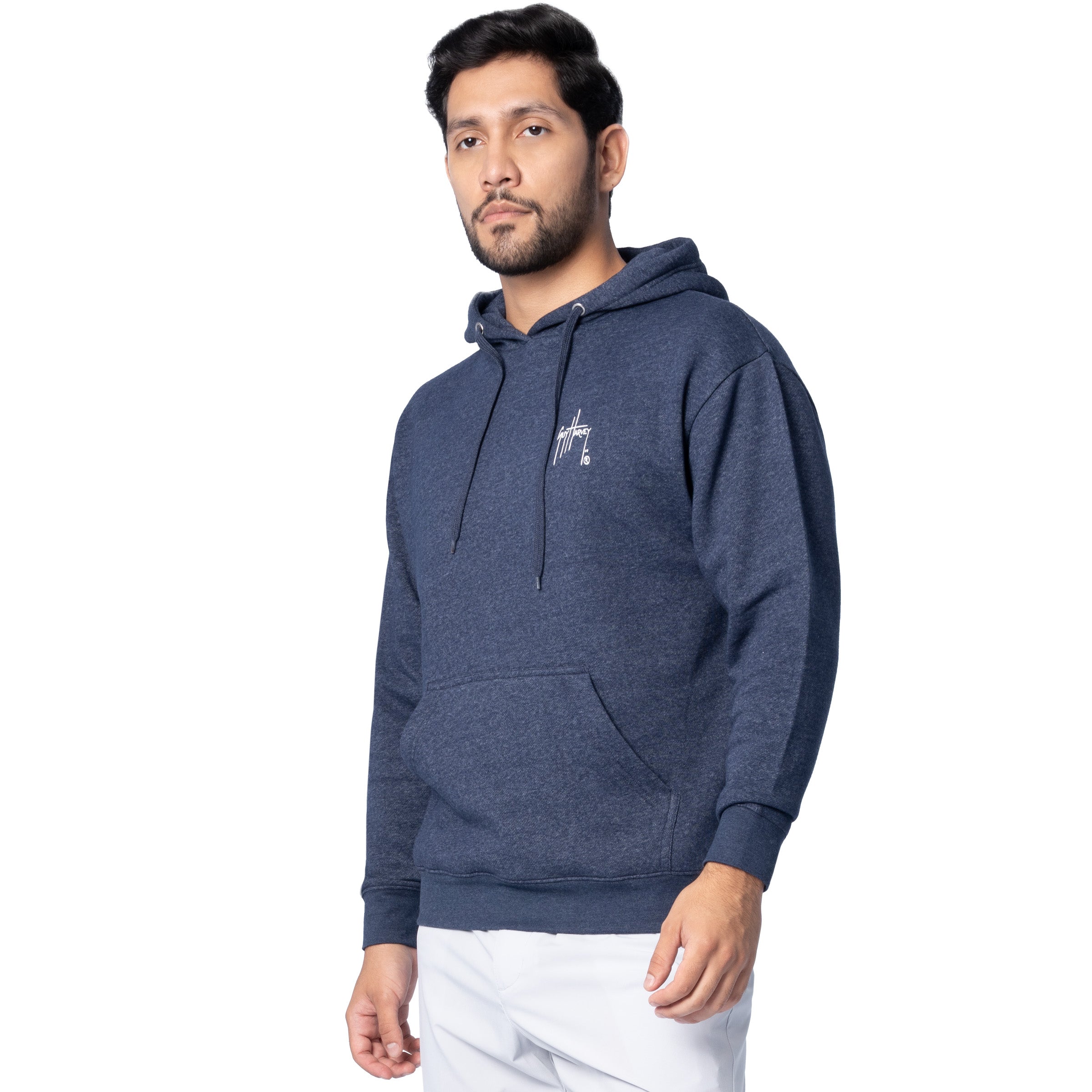 Side-front view of a man wearing a navy blue Guy Harvey fishing fleece hoodie showing the chest logo.
