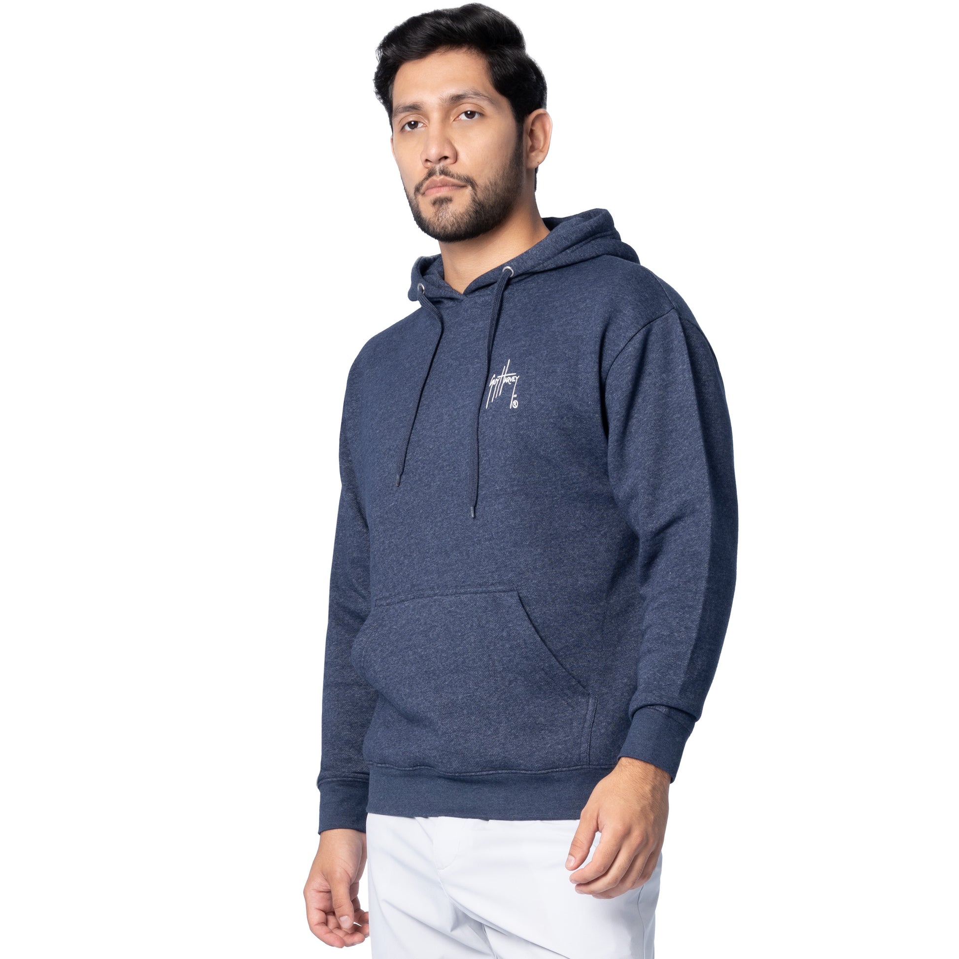 Side-front view of a man wearing a navy blue Guy Harvey fishing fleece hoodie showing the chest logo.