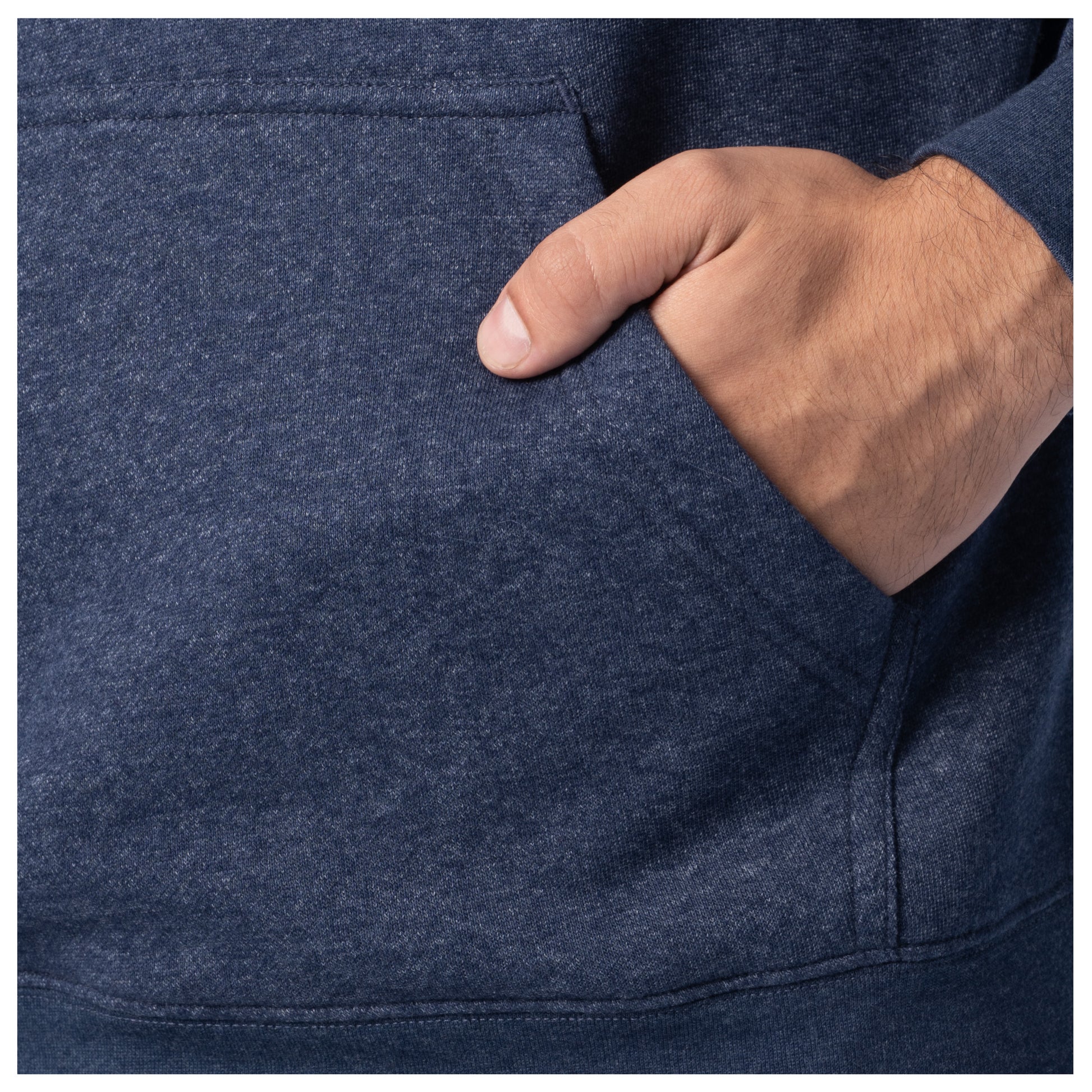 Close-up of a hand in the front pocket of a navy blue Guy Harvey fishing fleece hoodie.
