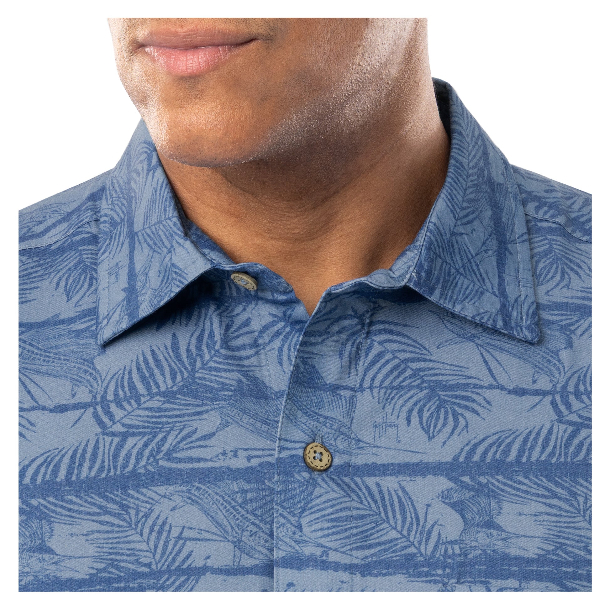 Detail of collar and coconut shell buttons on denim blue Guy Harvey Sandbar Resort Shirt.