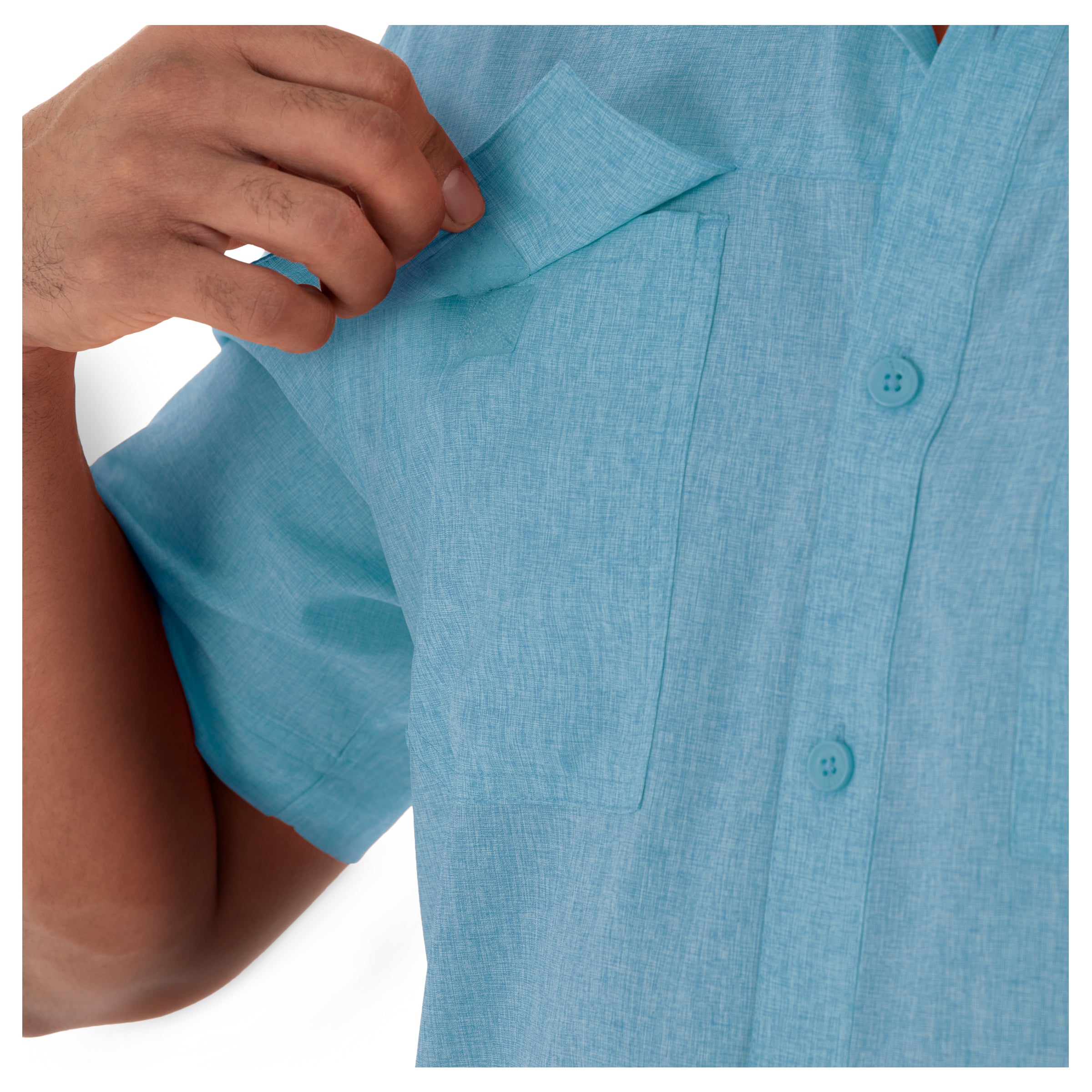 Close-up of a person wearing a blue shirt with buttons