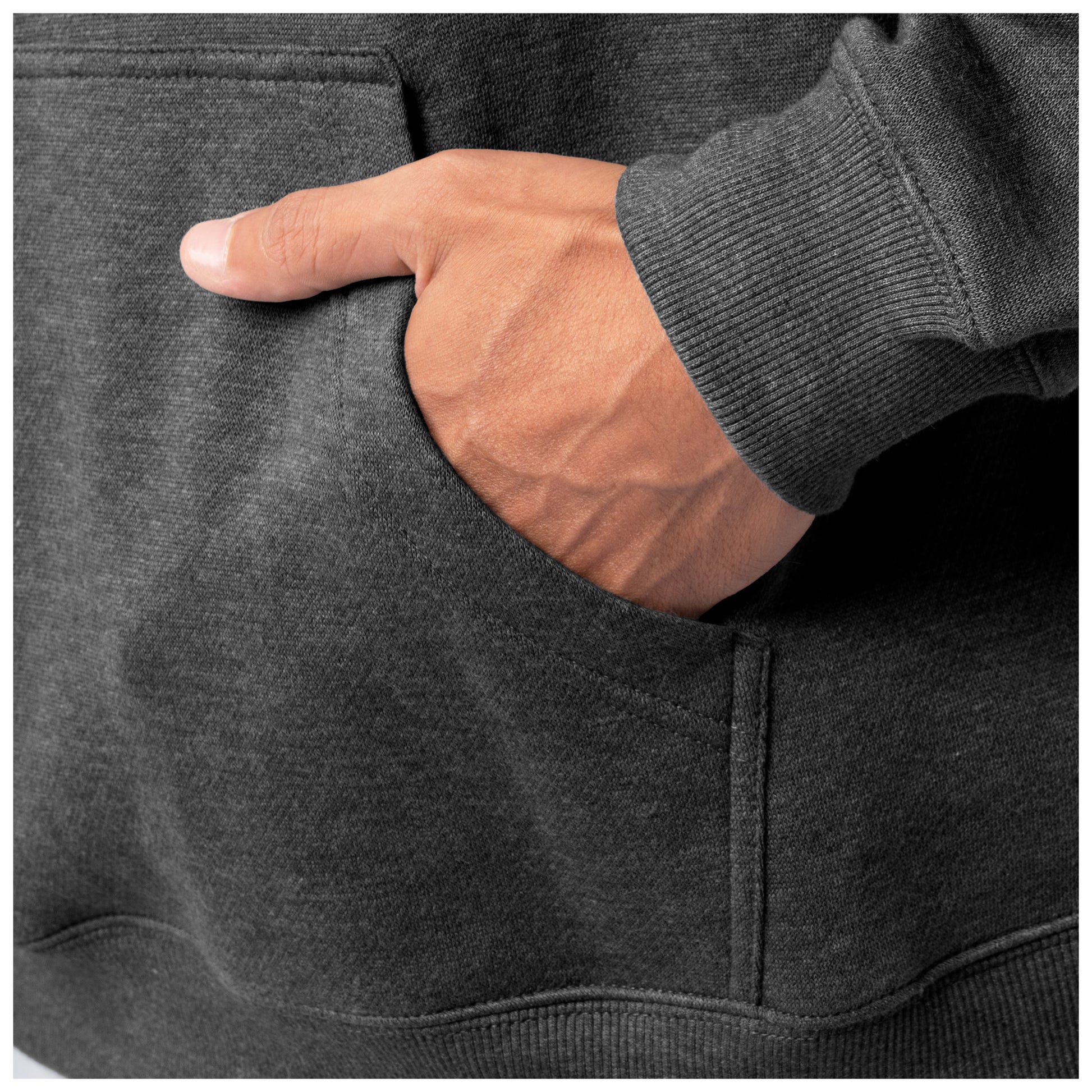 Close-up of a hand in the front pocket of a dark gray Guy Harvey fishing fleece hoodie.