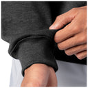 Close-up of sleeve cuff detail on a dark gray Guy Harvey fishing fleece hoodie.