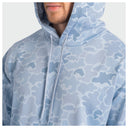 A close-up of a man wearing a light blue and white camouflage pattern hoodie, showing the drawstrings and part of his chin and beard.