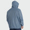 A man shown from the back wearing a hooded lightweight jacket in a muted dusty blue color, set against a plain light gray studio background.