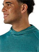 Man wearing a teal hoodie against a white background