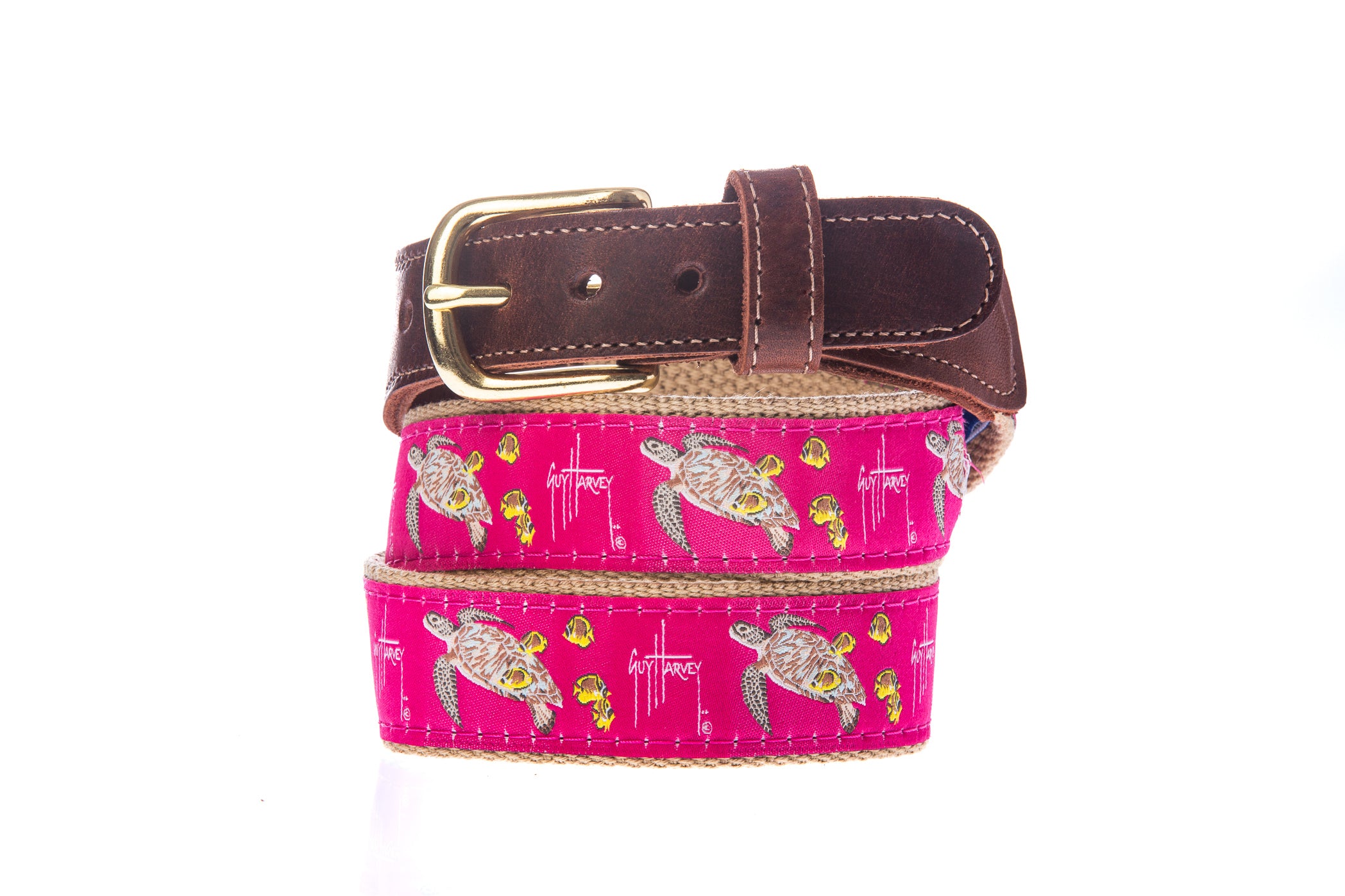 Guy Harvey Men’s Sea Turtle Leather Tab Belt with pink cotton webbing featuring sea turtles and tropical fish, brown leather tabs, and brass buckle
