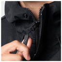 Close-up of a person wearing a black zip-front jacket, with a hand pulling the zipper tab to open the collar.