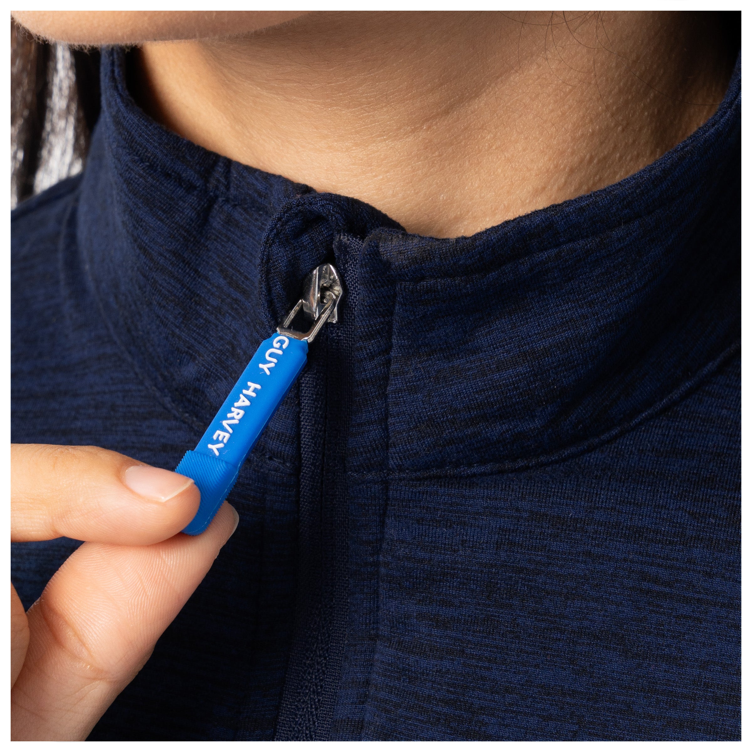 Zipper pull close-up with blue Guy Harvey branding