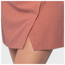 Close-up of a dusty rose wrap-style fishing skort with a side slit, shown on a model against a light gray background.