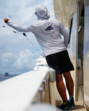 Person on a boat wearing a gray hoodie with a logo, fishing.