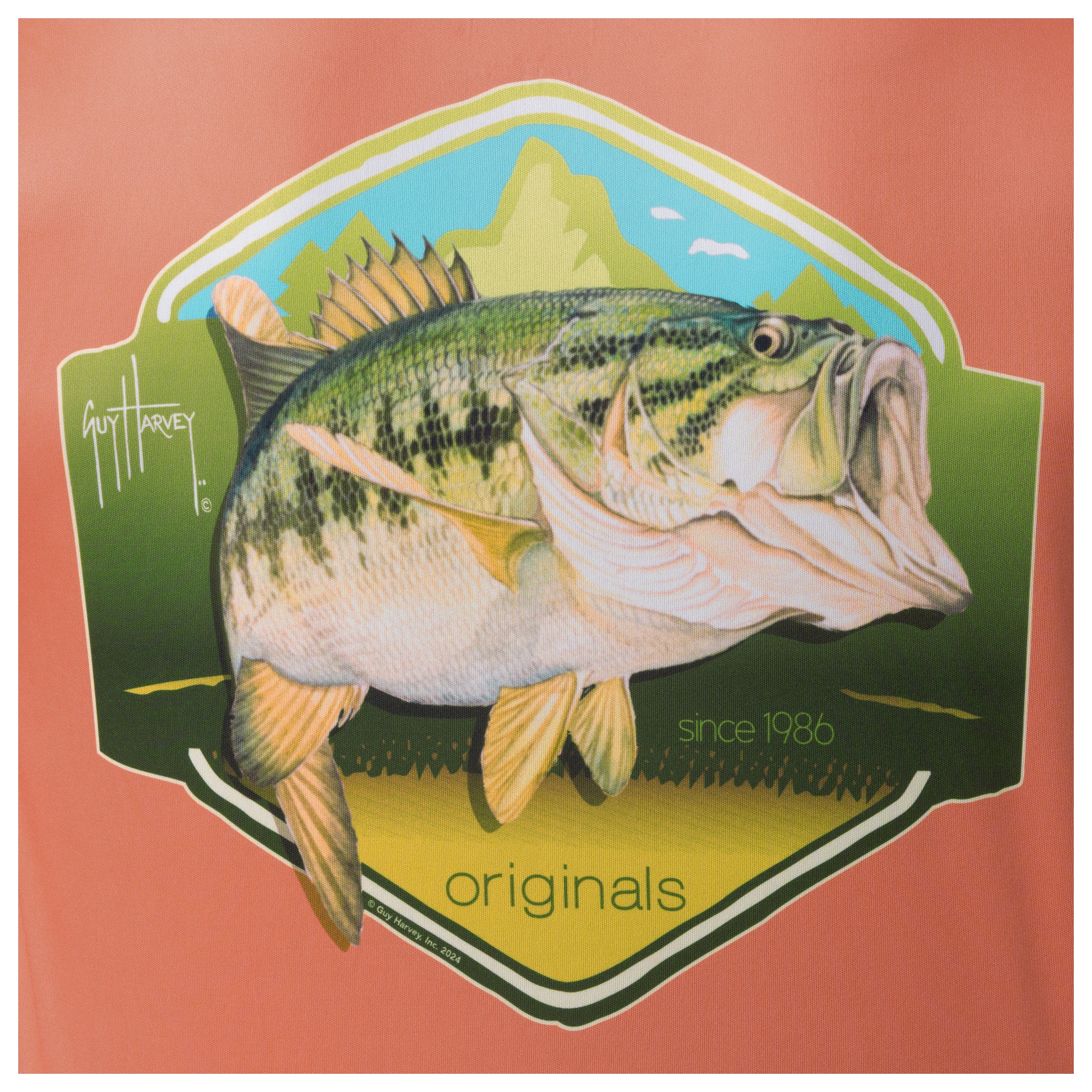 Detailed view of largemouth bass shield artwork on back of Guy Harvey Men’s Performance Top