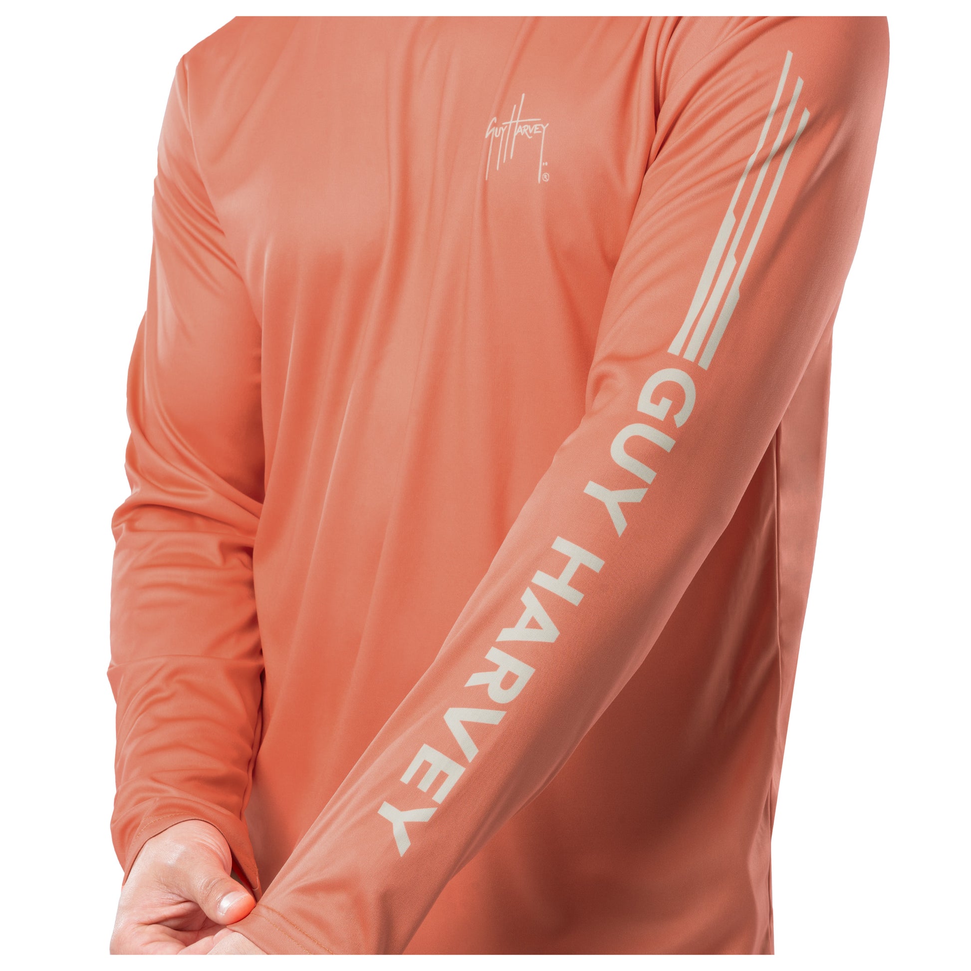 Close up on the long sleeve showcasing letters spelling "Guy Harvey" in bold white letters.