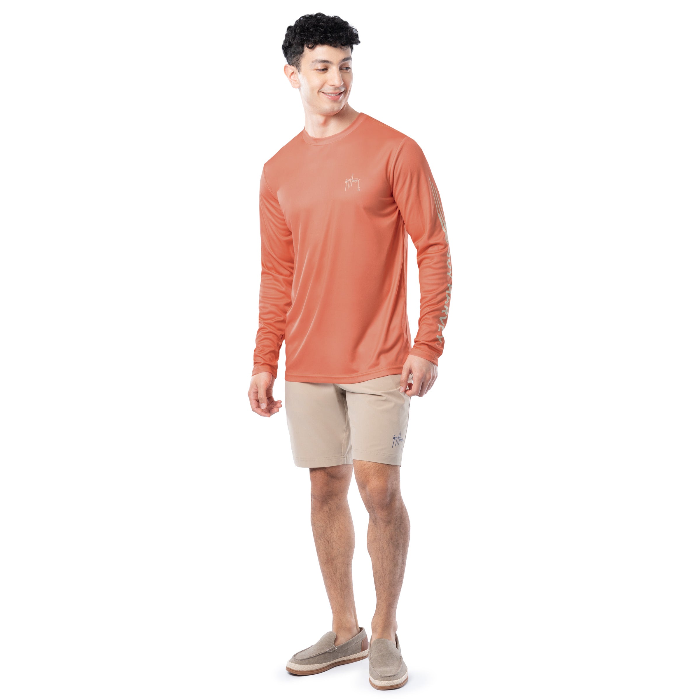 Lifestyle photo of model wearing Guy Harvey Men’s Bass Performance Sun Protection Long Sleeve Top