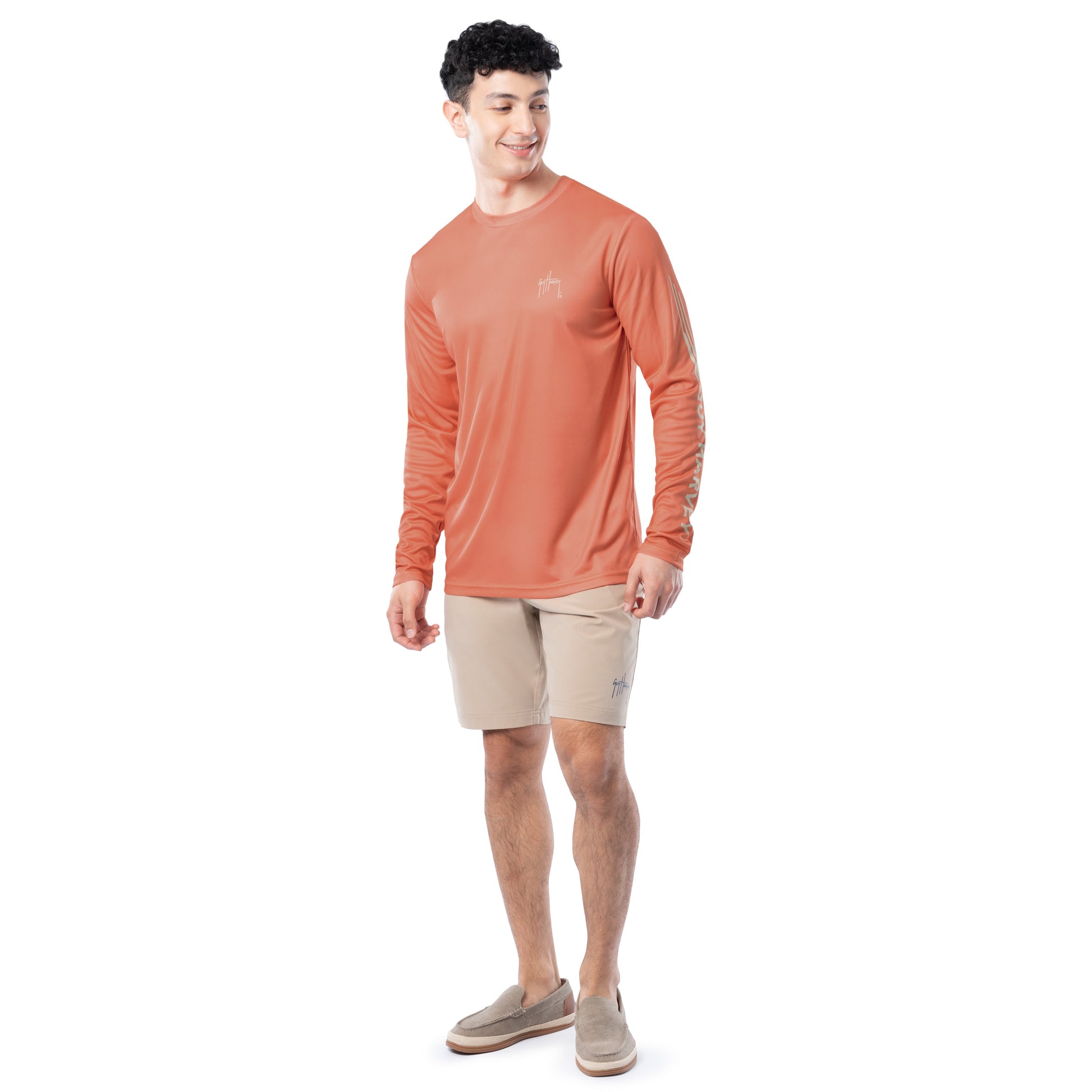 Lifestyle photo of model wearing Guy Harvey Men’s Bass Performance Sun Protection Long Sleeve Top