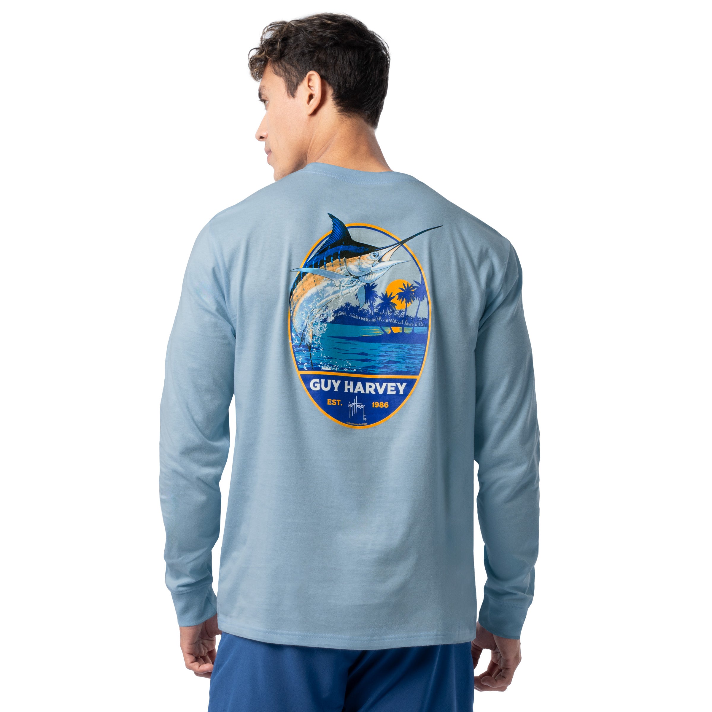 Back view of Guy Harvey Men’s Blue Hawaiian Long Sleeve Tee with marlin jumping and tropical island artwork
