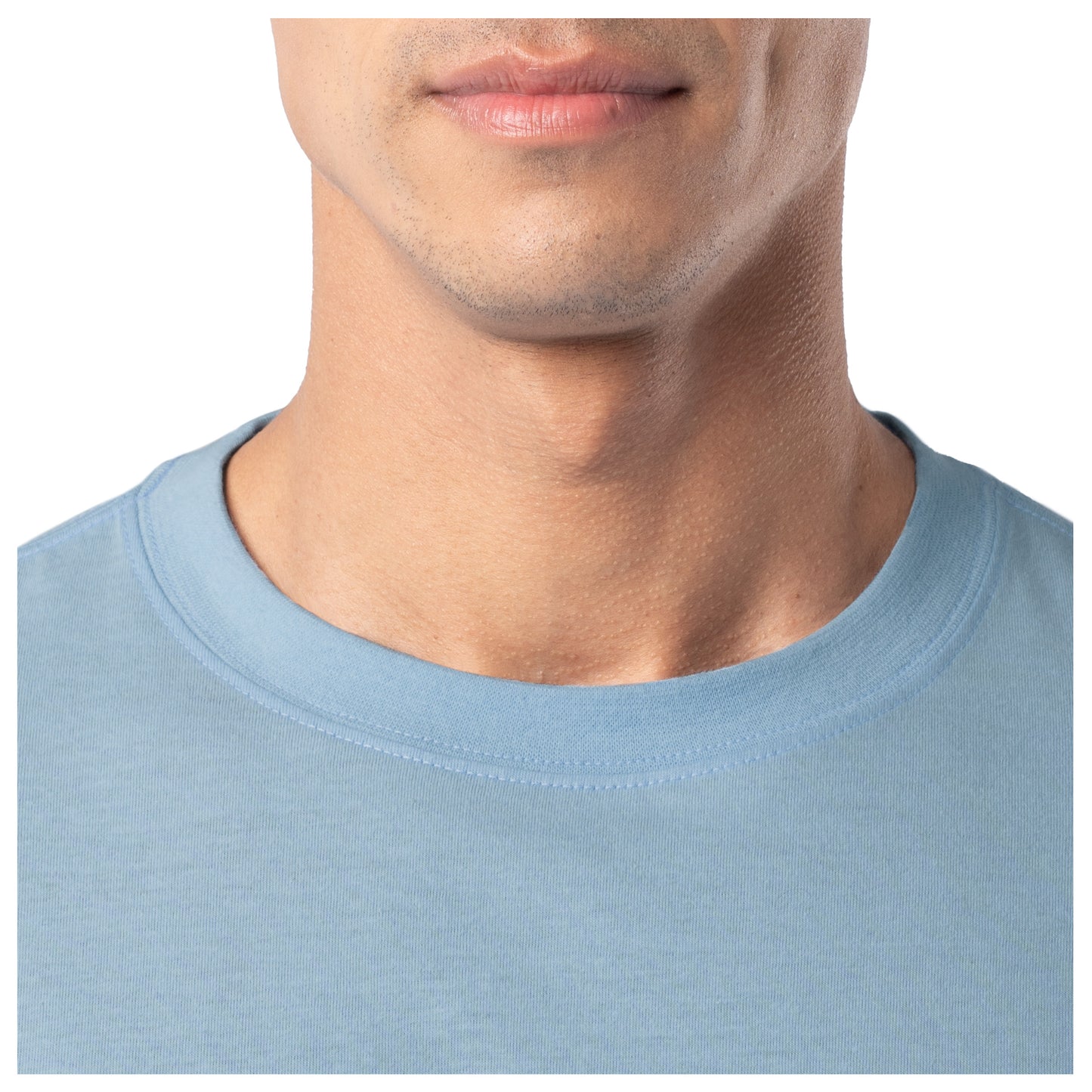 Close-up of a person wearing a light blue shirt with a plain background