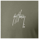 Close-up of chest Guy Harvey signature logo on Men’s Crab Stamp Long Sleeve Tee