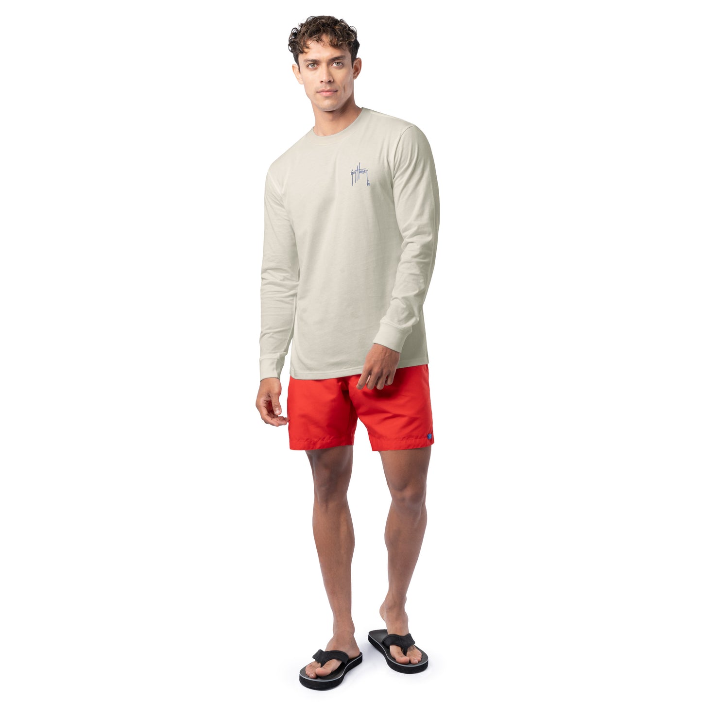 Lifestyle photo of model wearing Guy Harvey Men’s Glory Sail Lightweight Long Sleeve Tee for coastal patriotic style