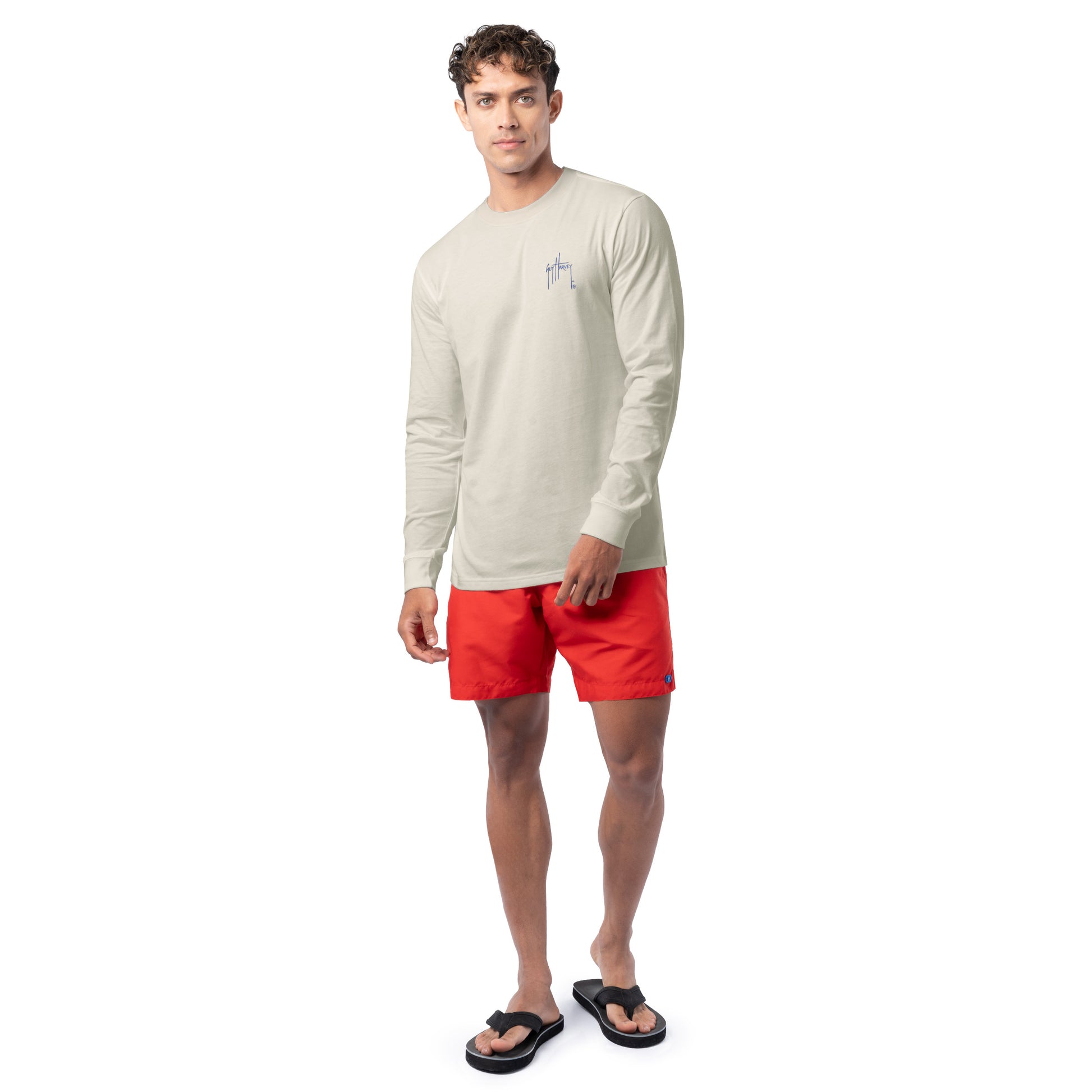 Lifestyle photo of model wearing Guy Harvey Men’s Glory Sail Lightweight Long Sleeve Tee for coastal patriotic style