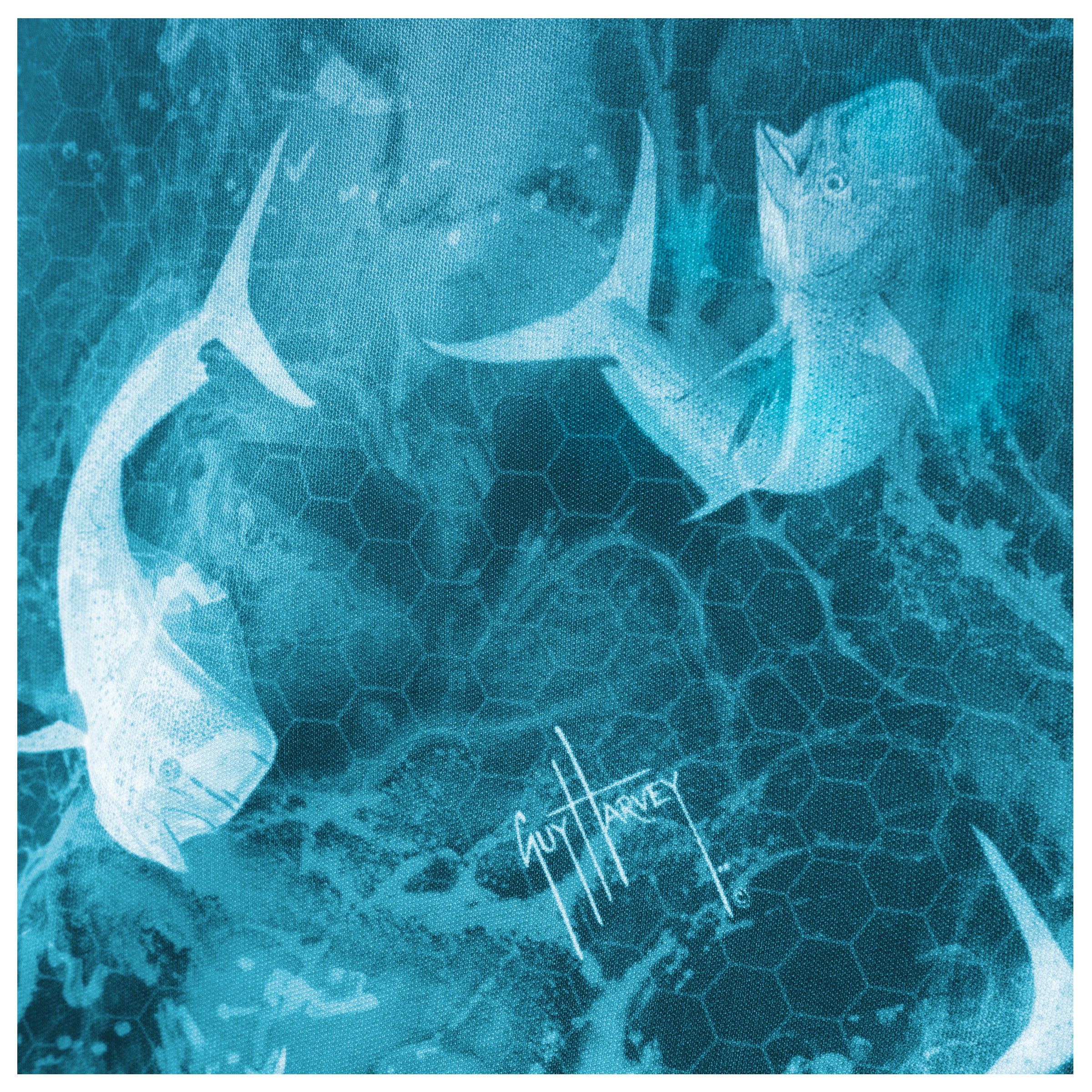 Detailed view of fade blue design with mahi-mahi artwork on back of Guy Harvey Men’s Performance Top