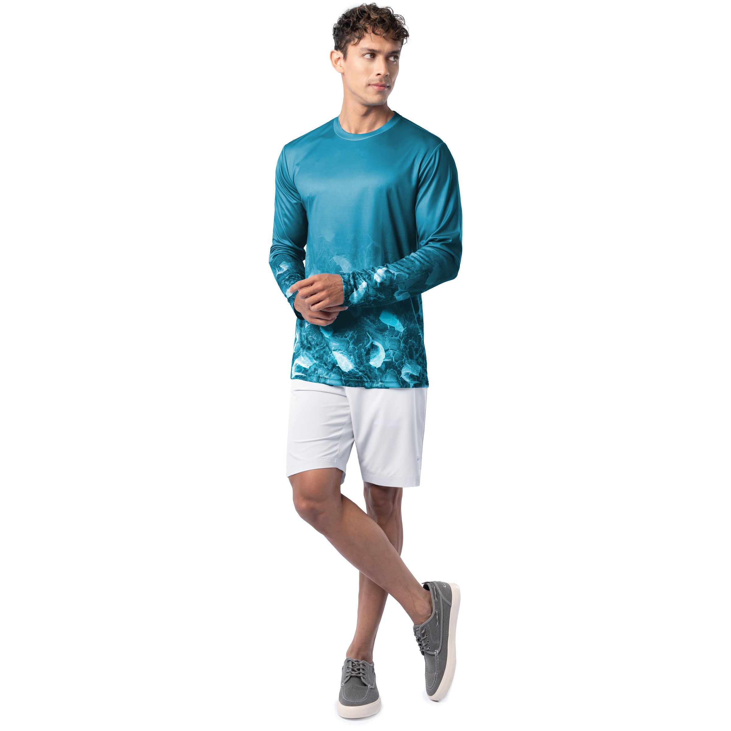 Lifestyle photo of model wearing Guy Harvey Men’s Mahi Bros Fade Blue Performance Sun Protection Long Sleeve Top