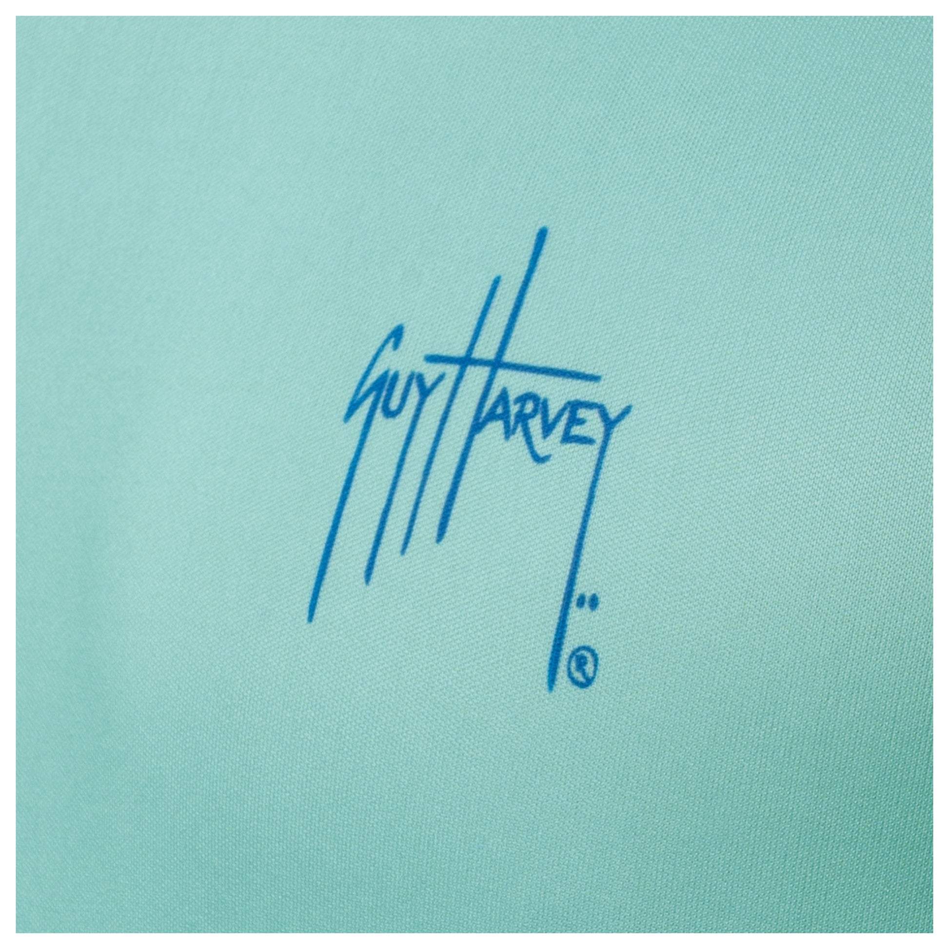 Close-up of chest Guy Harvey signature logo on Men’s Mahi Hex Performance Sun Protection Top