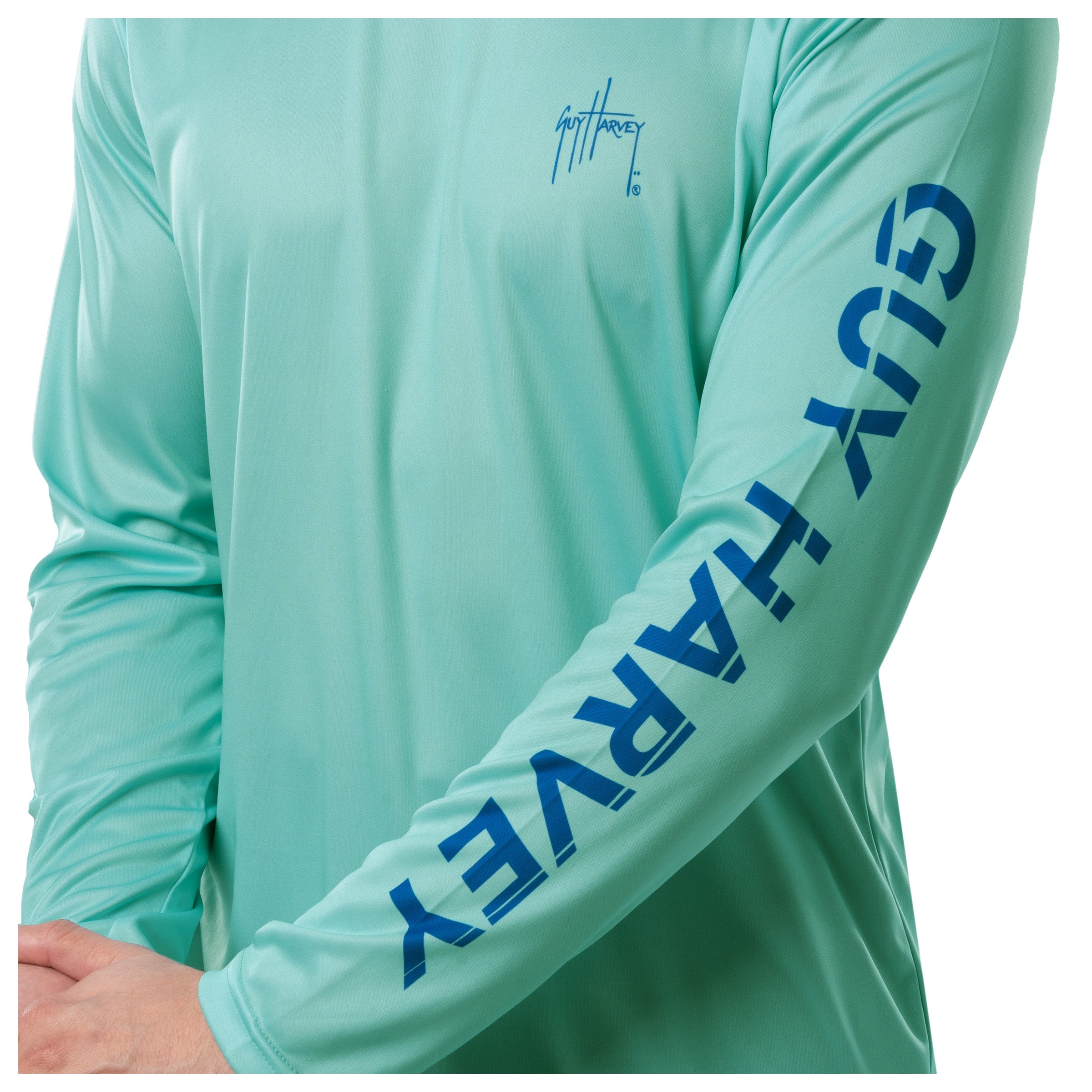 Detail view of the sleeve showing Guy Harvey in bold blue letters.