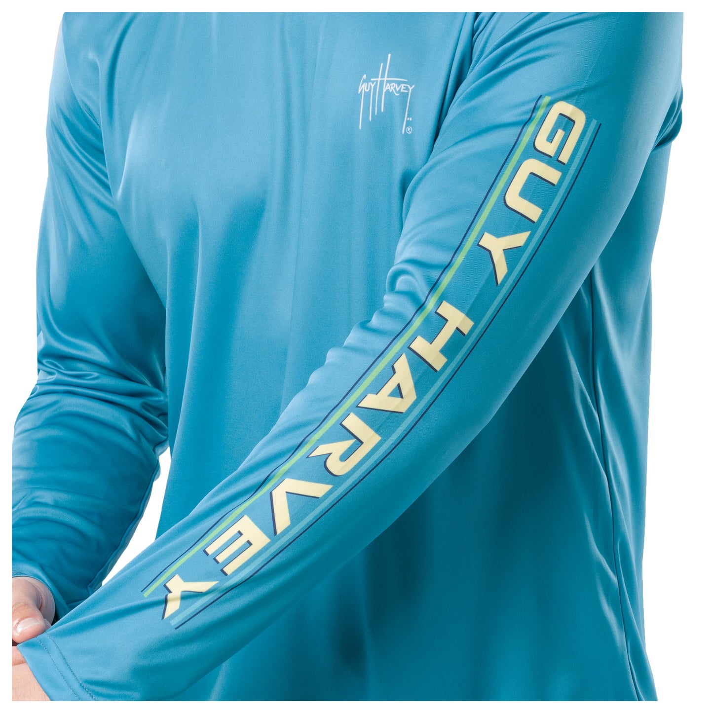 Close-up on sleeve showcasing the 'Guy Harvey' letter on bold white letters.
