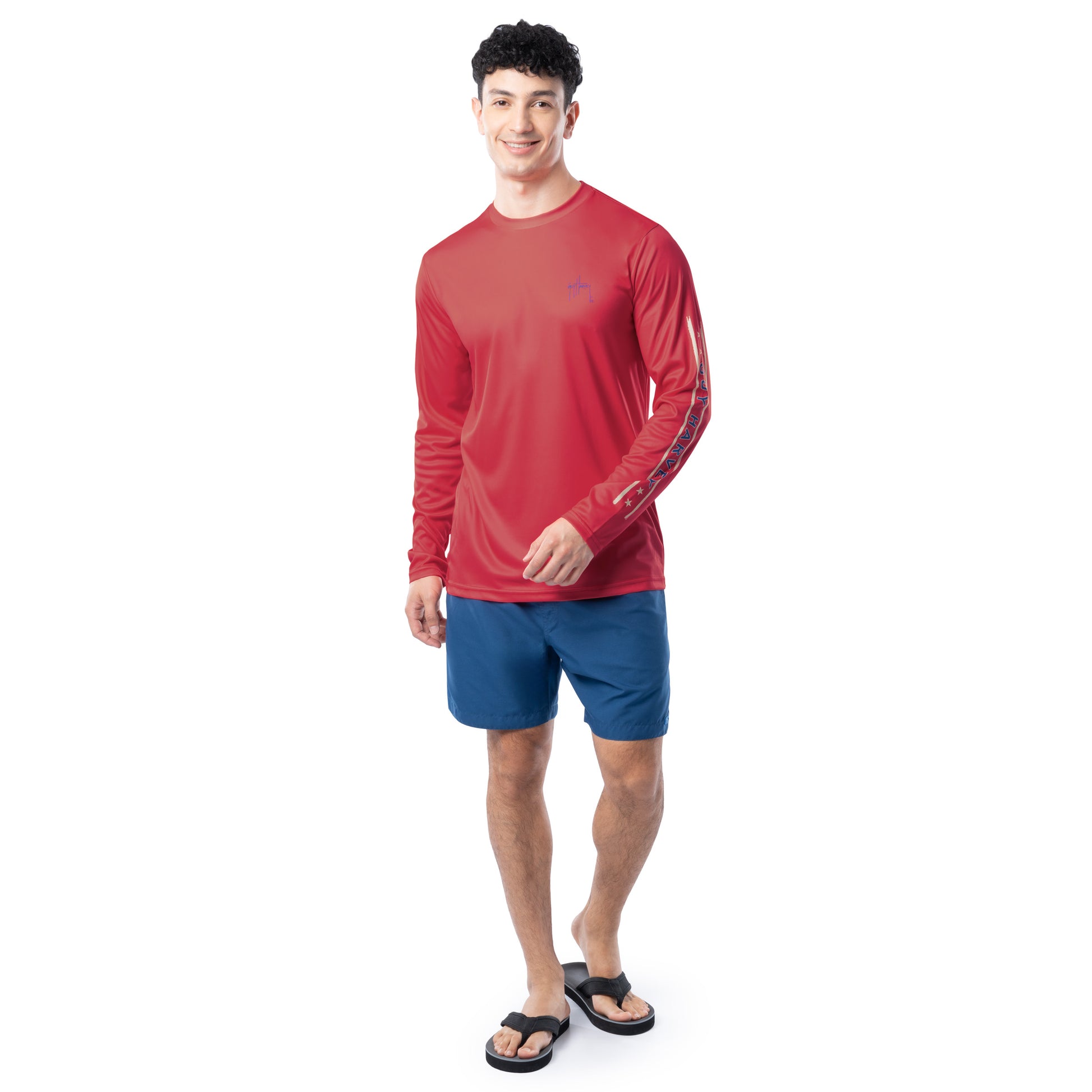 Lifestyle photo of model wearing Guy Harvey Men’s Marlin Americana Performance Sun Protection Long Sleeve Top